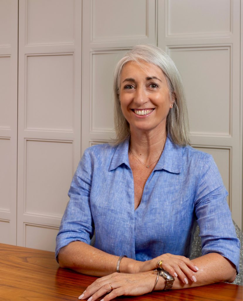 estate-agent-sitting-at-desk-in-office