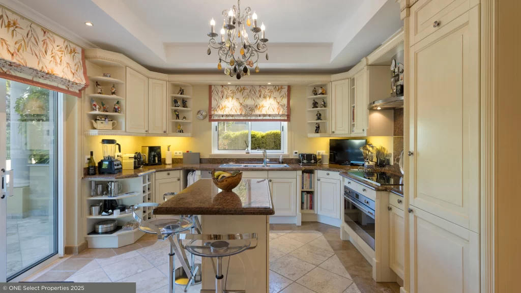 Modern SMEG-equipped kitchen at Villa Nina in Quinta do Mar with natural light and luxury finishes.