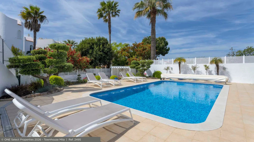 Pool and landscaped garden at an Algarve property in summer