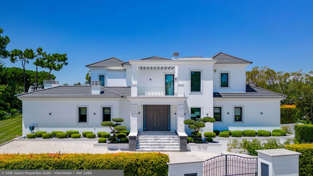 Front façade of Villa Nobel, an established contemporary villa surrounded by gardens in Quinta do Lago.